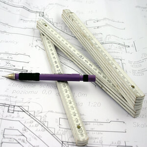 Ruler and Pen sitting on top of paperwork