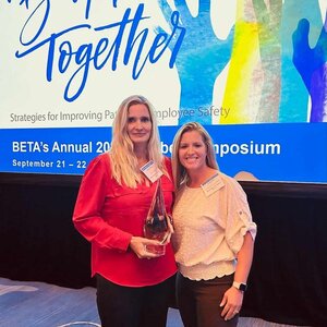 Mayers Memorial Healthcare District Earns Prestigious BETA Award for Outstanding Slip, Trip, Fall Program Implementation. Two females smiling with award.